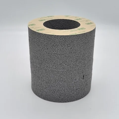 Laminated silicone foam cushioning pad